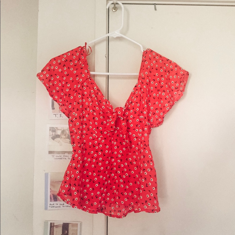 Bright red floral blouse